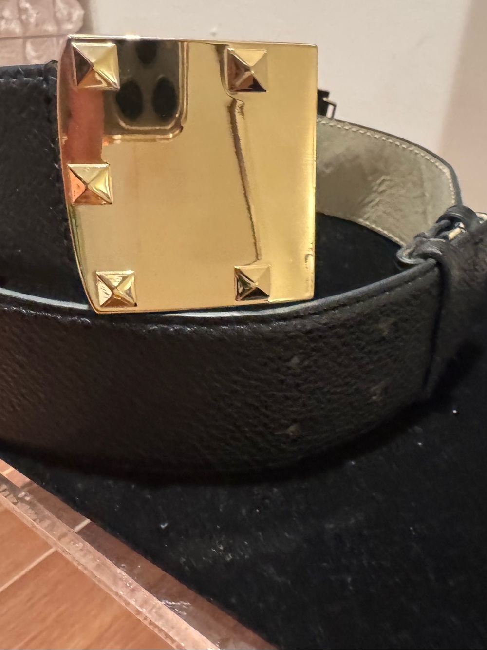 BCBG Black Faux Leather Belt with Gold Pyramid Stud Buckle.
34” long.